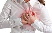 woman touching chest 