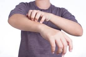 boy scratching 