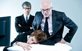 angry boss at sleeping man 